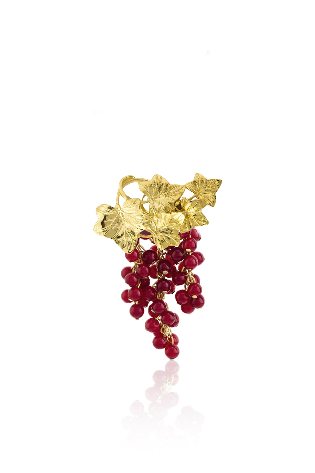 A gold-plated ring with a cluster of red jade stones and leaf detailing.