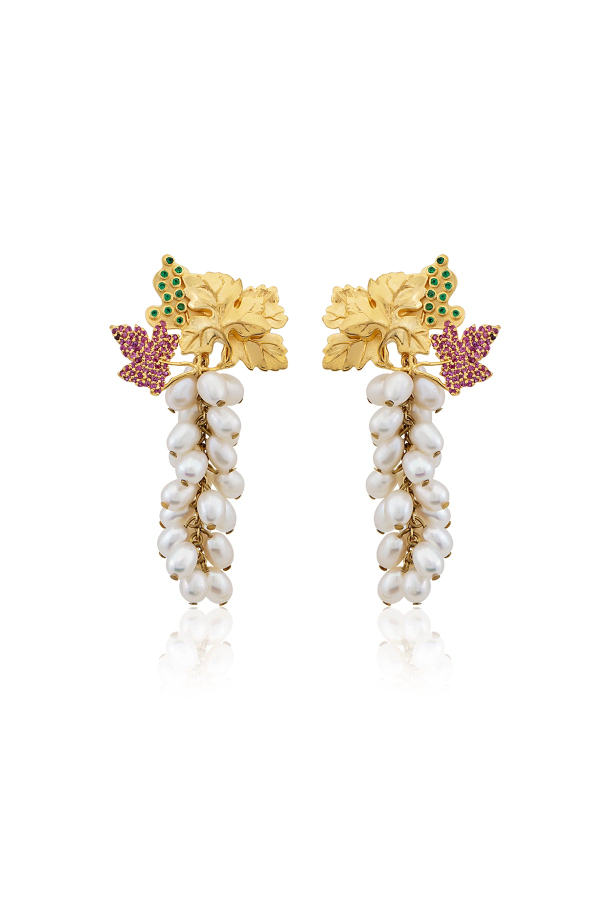 A pair of gold-plated earrings featuring baroque pearls, swarovski crystals, and floral accents.