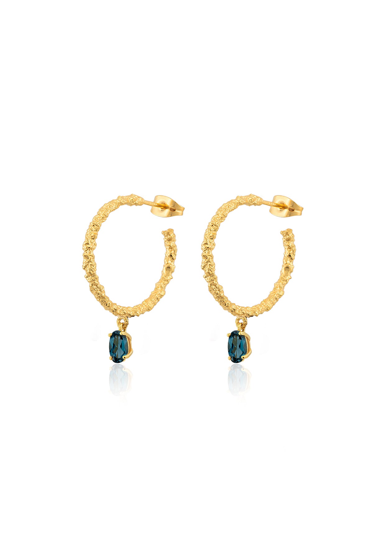 A pair of gold-colored hoop earrings with blue stones attached to the bottom, closed with a pin clasp.